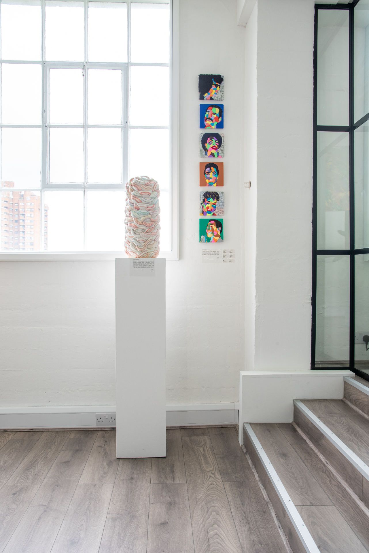 Agape Space — vessel on plinth with portrait series